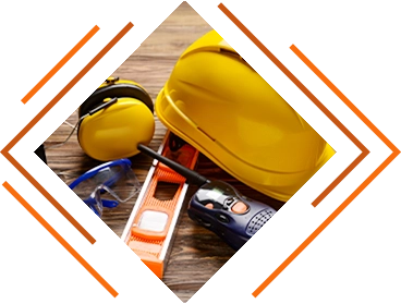 stylized photo of closeup construction and safety gear (hard hat, 2-way radio, hearing protection, eye protection, etc.) - About KSK page decorative image