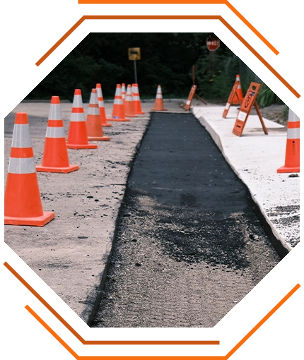 stylized photo of a traffic safety zone around a utility repair site (KSK traffic control services decorative image)